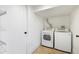 Bright laundry room with tile floors features a modern washer and dryer at 2738 W 38Th Ave, Denver, CO 80211