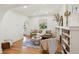 Bright living room featuring hardwood floors, a cozy seating area, and a fireplace at 2738 W 38Th Ave, Denver, CO 80211