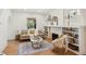Inviting living room with hardwood floors, a fireplace, and cozy seating arrangement at 2738 W 38Th Ave, Denver, CO 80211