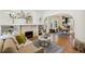 Cozy living room featuring hardwood floors, a fireplace, and ample natural light at 2738 W 38Th Ave, Denver, CO 80211