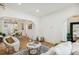 Open concept living room with hardwood floors, a marble coffee table, and white walls at 2738 W 38Th Ave, Denver, CO 80211