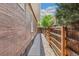 Narrow side yard with a gravel bed and a tall wood fence for privacy at 2738 W 38Th Ave, Denver, CO 80211