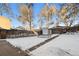 Spacious backyard with shed and snow covered ground at 3024 S Sherman St, Englewood, CO 80113