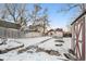 Large backyard with shed and snow covered ground at 3024 S Sherman St, Englewood, CO 80113