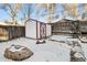 Backyard with shed and snow covered ground at 3024 S Sherman St, Englewood, CO 80113