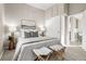 Cozy bedroom featuring a comfortable bed, decorative pillows, and modern décor at 3024 S Sherman St, Englewood, CO 80113