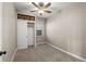 This bedroom features closet, storage shelves, neutral paint and carpet at 3024 S Sherman St, Englewood, CO 80113