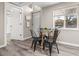Dining area with modern furniture and natural light, adjacent to a doorway and exterior door at 3024 S Sherman St, Englewood, CO 80113