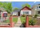 Charming home featuring a well-maintained front yard with a walkway leading to the front door and a 'For Sale' sign at 3024 S Sherman St, Englewood, CO 80113