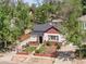 Charming single-story home featuring a landscaped front yard, red brick accents, and a 'For Sale' sign at 3024 S Sherman St, Englewood, CO 80113