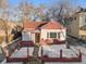 Charming house with snow covered front yard at 3024 S Sherman St, Englewood, CO 80113