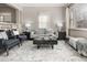 Bright living room featuring neutral colors, large windows, and a stylish rug at 3024 S Sherman St, Englewood, CO 80113
