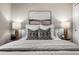 Comfortable main bedroom with nightstands, lamps, neutral bedding, and wall art at 3024 S Sherman St, Englewood, CO 80113