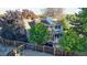 Backyard aerial view featuring a privacy fence, mature trees, and a patio with outdoor furniture at 4998 W 101St Ave, Westminster, CO 80031