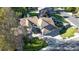 Stunning aerial view of a home with lush landscaping, mature trees, and a well-maintained lawn at 4998 W 101St Ave, Westminster, CO 80031