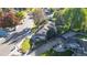 Aerial view of home showing roof, surrounding neighborhood, mature trees, and manicured lawn at 4998 W 101St Ave, Westminster, CO 80031