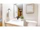 Modern bathroom with a white vanity, black hardware, and neutral decor at 4998 W 101St Ave, Westminster, CO 80031