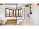 Bright bathroom featuring a jacuzzi tub, decorative windows and a glass enclosed shower at 4998 W 101St Ave, Westminster, CO 80031