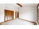 Bedroom with natural light, wood trim, vaulted ceilings, and a closet with shutter doors at 4998 W 101St Ave, Westminster, CO 80031