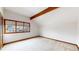 Bedroom with natural light from multiple windows, neutral carpet, and wood accent beam at 4998 W 101St Ave, Westminster, CO 80031