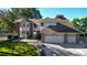 Charming home featuring a brick and siding facade, a two-car garage, and a well-manicured lawn at 4998 W 101St Ave, Westminster, CO 80031