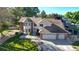 Inviting home featuring a brick and siding facade, a two-car garage, and mature landscaping at 4998 W 101St Ave, Westminster, CO 80031