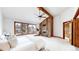 Spacious bedroom features vaulted ceiling, brick fireplace, and bright windows at 4998 W 101St Ave, Westminster, CO 80031