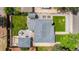 Aerial view of a home showcasing its backyard patio, detached garage, and well-maintained landscaping at 5369 S Sherman St, Littleton, CO 80121