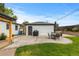 Beautiful backyard with a patio, umbrella table, and detached garage, creating an inviting outdoor space at 5369 S Sherman St, Littleton, CO 80121