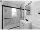 Modern bathroom featuring a glass shower enclosure and a sleek vanity at 5369 S Sherman St, Littleton, CO 80121