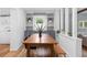 Bright dining room with built-in cabinets and a wooden table perfect for entertaining at 5369 S Sherman St, Littleton, CO 80121