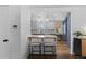 Modern kitchen featuring white cabinets, stylish pendant lights, and a cozy breakfast bar at 5369 S Sherman St, Littleton, CO 80121