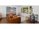 Bright living room featuring a large window with front porch view and modern furnishings at 5369 S Sherman St, Littleton, CO 80121