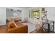 Bright living room featuring a large window with front porch view and modern furnishings at 5369 S Sherman St, Littleton, CO 80121