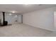 Spacious finished basement features recessed lighting, neutral colored carpet, and a wood burning stove at 6280 Quay St, Arvada, CO 80003