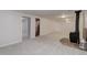 Finished basement with neutral carpet, gas burning fireplace with stone hearth, and neutral wall paint at 6280 Quay St, Arvada, CO 80003