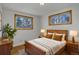 Bedroom with hardwood floors, natural light, and minimalist design at 6280 Quay St, Arvada, CO 80003