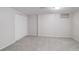 Spacious bedroom with neutral carpet, ample closet space, and a window providing natural light at 6280 Quay St, Arvada, CO 80003