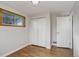 Empty room with hardwood floors, closet, and natural light at 6280 Quay St, Arvada, CO 80003