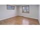 Bright bedroom featuring hardwood floors, and two windows that bring in natural light at 6280 Quay St, Arvada, CO 80003