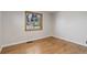 Bedroom featuring hardwood floors, white walls, and window that brings in natural light at 6280 Quay St, Arvada, CO 80003