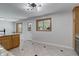 Bright and airy kitchen with granite counters, stainless appliances, and ample cabinet storage at 6280 Quay St, Arvada, CO 80003