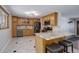 Spacious kitchen with granite countertops, stainless steel appliances, and ample cabinet space at 6280 Quay St, Arvada, CO 80003