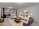 Cozy living room featuring a fireplace, modern furniture, and access to a dining area at 6280 Quay St, Arvada, CO 80003