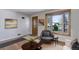 Inviting living room with hardwood floors, bright window, neutral decor, and stylish furnishings at 6280 Quay St, Arvada, CO 80003