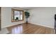Living room with hardwood floors, bay windows, recessed lighting, and neutral colored walls at 6280 Quay St, Arvada, CO 80003