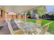 Covered patio with outdoor seating area, overlooking a green backyard with a storage shed at 6280 Quay St, Arvada, CO 80003