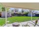 Covered patio offering shade and views of the sheds and fenced backyard at 6280 Quay St, Arvada, CO 80003