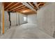 Unfinished basement with concrete walls/floor, featuring a window that provides natural light at 1972 S Carr St, Lakewood, CO 80227