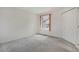 Carpeted bedroom features a large window and closet at 1972 S Carr St, Lakewood, CO 80227